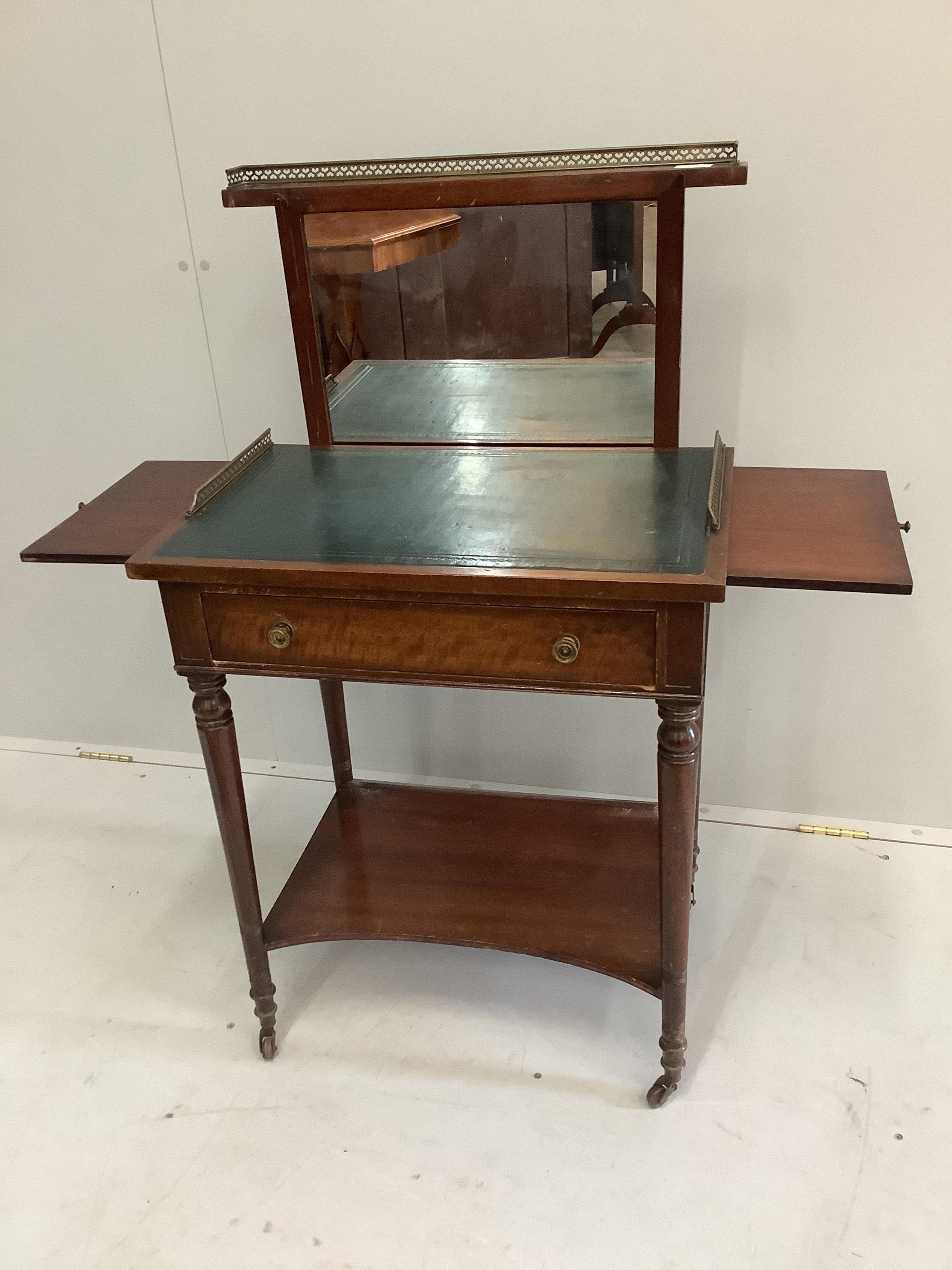 A Regency style mahogany writing / dressing table with rising mirror, width 62cm, depth 45cm, height 75cm. Condition - fair